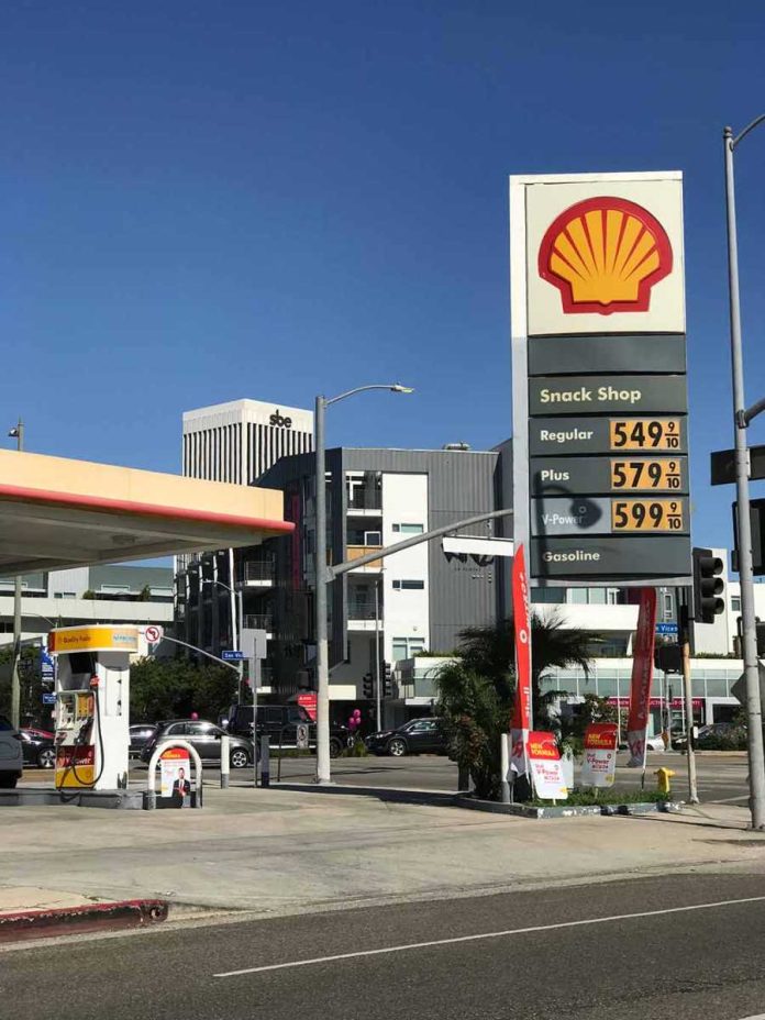 Shell gas station with price sign on a sunny day