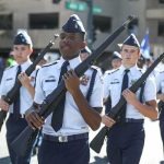 cadets marching in formation with rifles