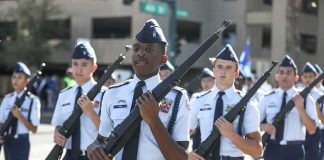 cadets marching in formation with rifles