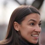 woman speaking outdoors in profile