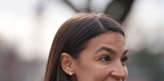 woman speaking outdoors in profile