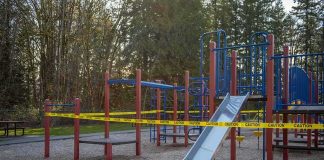 Playground equipment wrapped with caution tape