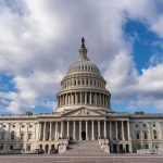Fetterman’s Ultimatum Has Dems Panicking! United States Capitol building under a partly cloudy sky