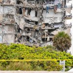 Partially collapsed apartment building with exposed interiors