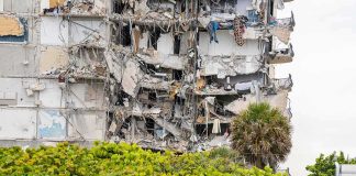 Partially collapsed apartment building with exposed interiors