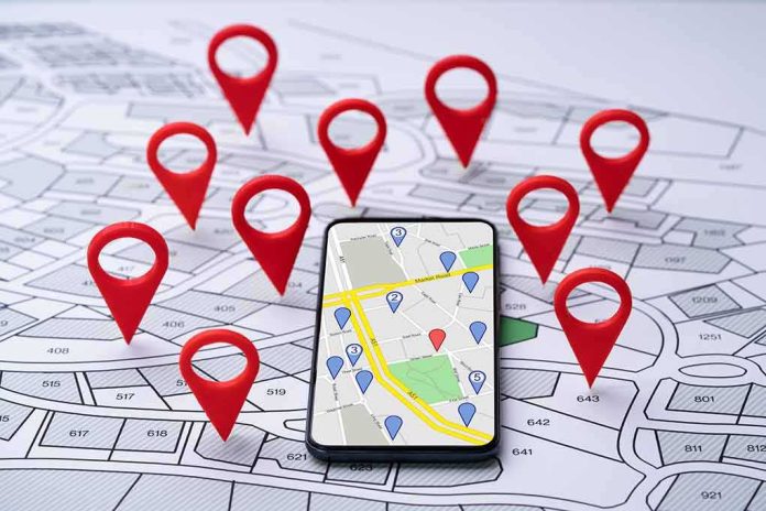 Smartphone with map app surrounded by red location pins