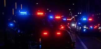 E-Bike Gangs Wrecking Cities Across The U.S Police vehicles with flashing red and blue lights at night