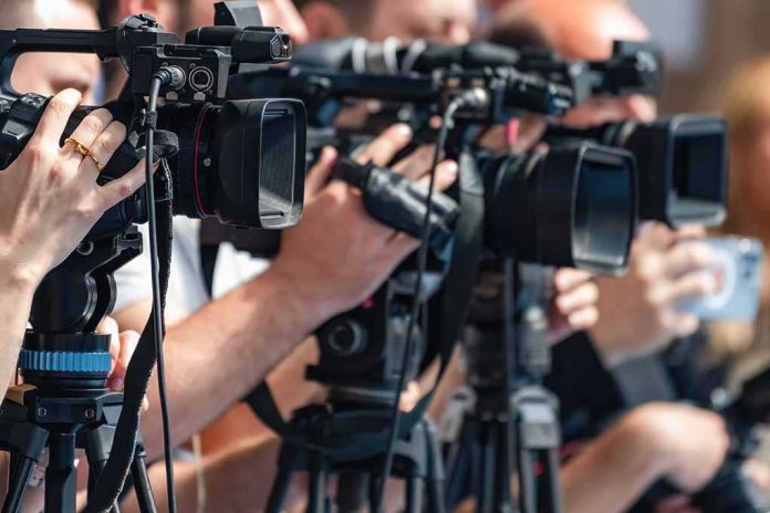 shutterstock_2692761619-2 television cameras on tripods at a media event