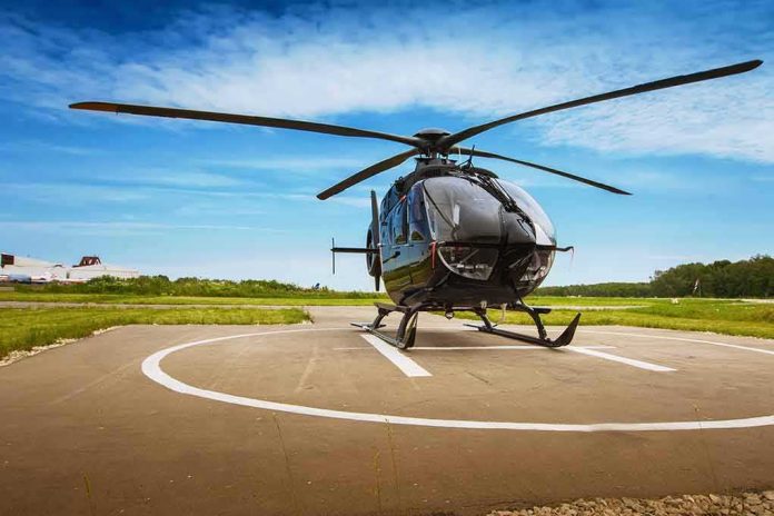 shutterstock_308514545 Black helicopter on a helipad