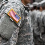 Iran Puts BOUNTY On U.S. Soldiers Soldier in camouflage uniform with U.S. flag patch