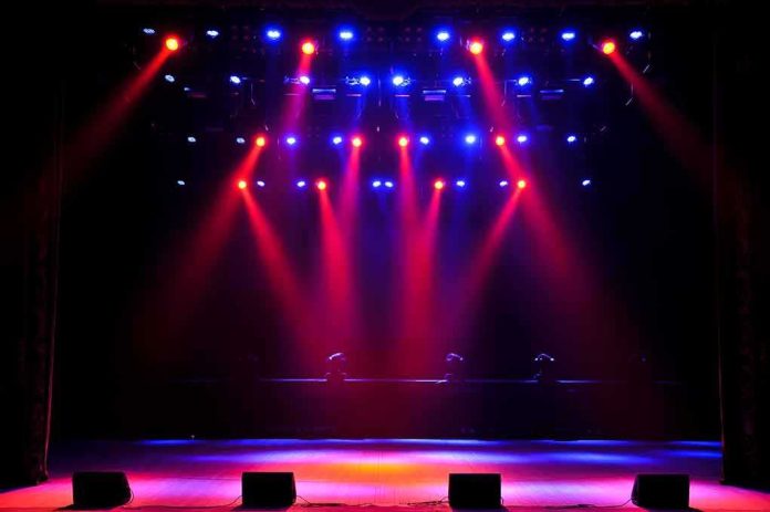 stage with red and blue spotlights shining onto an empty floor