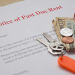 Past due rent notice with cash, coins, and house keys