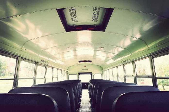 Empty school bus interior with rows of seats