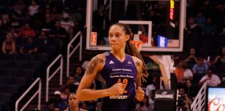 Brittney Griner running on a basketball court during a game