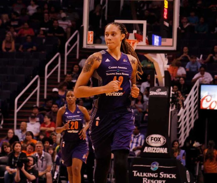 Brittney Griner running on a basketball court during a game