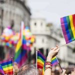 Pride flags waved at a city parade
