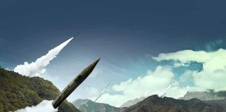 mobile missile launcher firing in mountain landscape