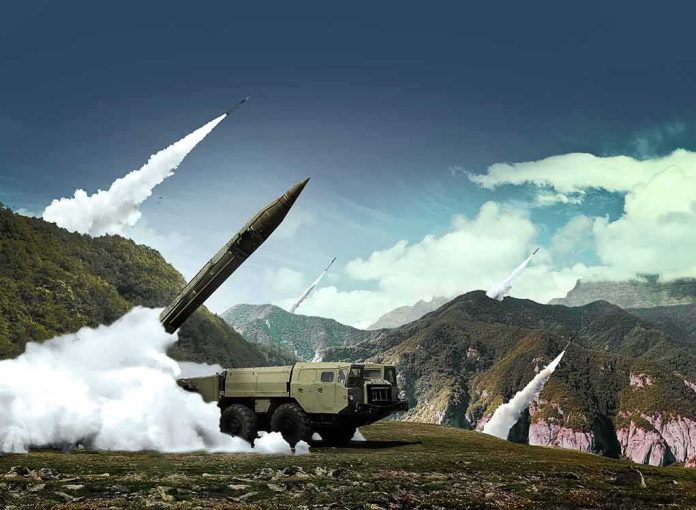 mobile missile launcher firing in mountain landscape