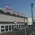 Trump Pulls ALL Troops After Decades-Long Mission airport terminal exterior with modern facade and roadway