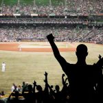 MLB Team SHUNS Pitcher Over Christian Views Crowd of fans cheering at a baseball game in a stadium