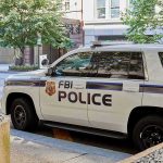 FBI police K-9 SUV parked on a city street