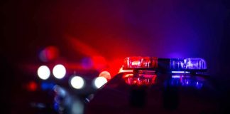 Mom GUNS DOWN 4-Year-Old, Then Herself Police car light bar flashing red and blue at night