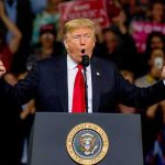 Trump Calls Somalia a ‘SH*T House’ During Rant Donald Trump speaking at a rally podium with arms raised