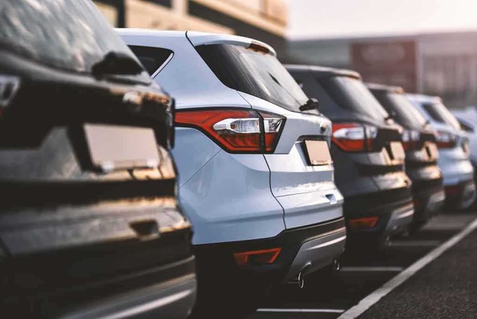 shutterstock_1378241768 Row of parked SUVs in a lot