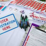 Sydney Sweeney Makes the Case for Voter ID in Brilliant Ad Voter registration table with forms, pens, and informational materials