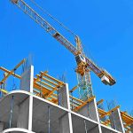 China Sets Up Caribbean Base – Too Close To Home Tower crane over concrete building under construction