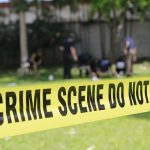 Teen Runners Stumble On Missing Person Corpse crime scene tape cordoning off a grassy area