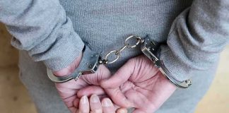 Mayor BUSTED – Charged In Grand Theft Auto Scheme person in handcuffs with hands behind back